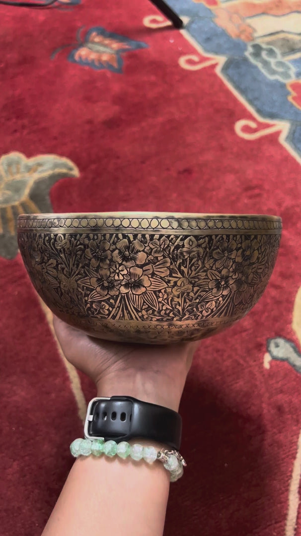 Semi antique Tibetan singing bowl with detailed floral and foliage engraving, handcrafted in Nepal