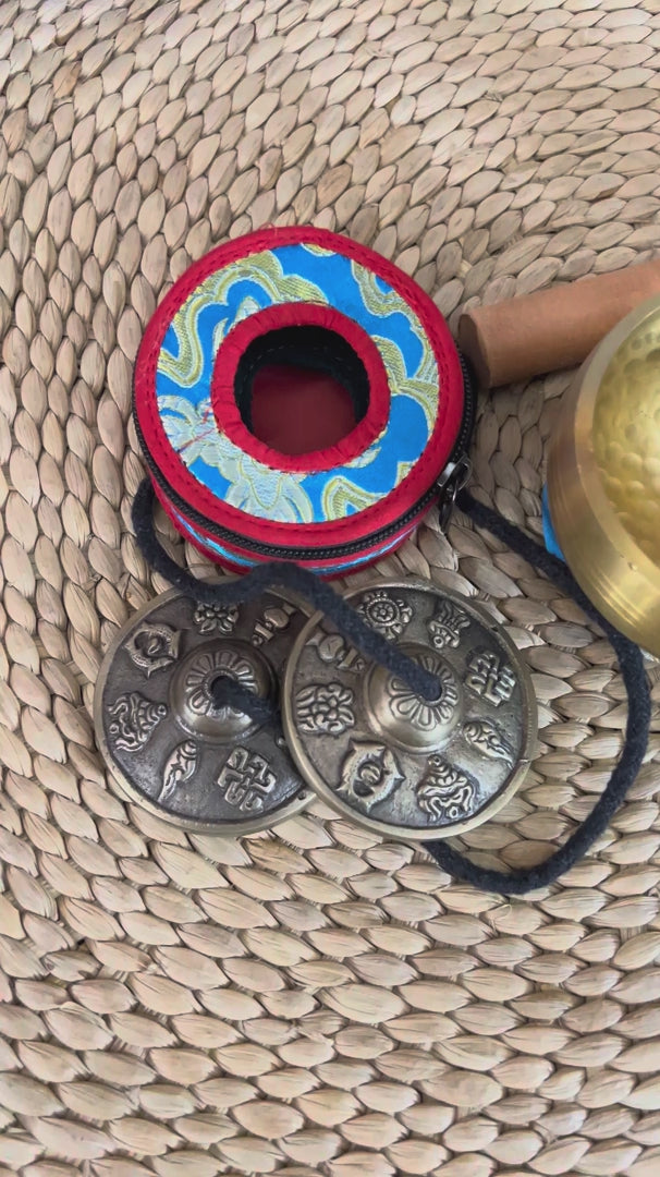 Buddhist meditation and ritual set from Nepal featuring singing bowl, tingsha, bell, vajra, cushion and traditional accessories