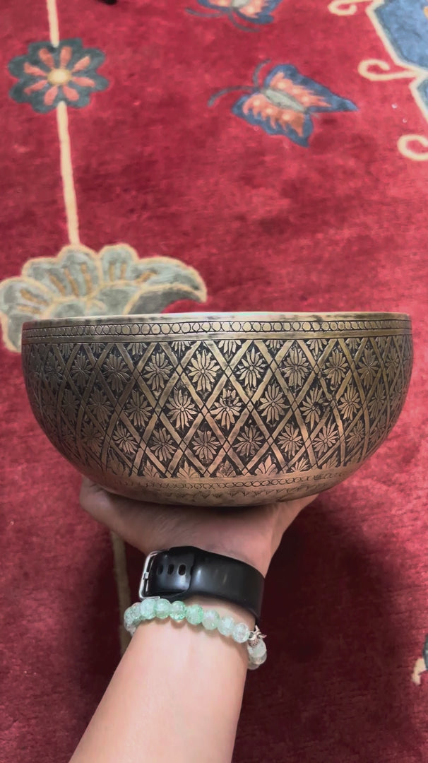 Semi antique Tibetan singing bowl with diamond floral engraving, handcrafted in Nepal with traditional Himalayan design