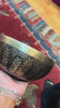 Handcrafted Yin Yang singing bowl from Nepal with floral engraving and bronze-gold finish for meditation and sound practice.