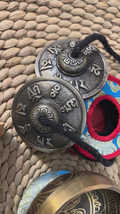 Lotus design singing bowl set with Ashtamangala tingsha, wooden mallet, cushion and Buddhist devotional accessories from Nepal