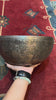 Semi antique handmade singing bowl with intricate flower vase engraving and floral patterns on aged bronze